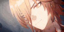 a close up of a person 's face with long hair and a smile .