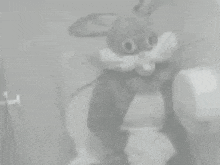 a black and white photo of a bunny costume
