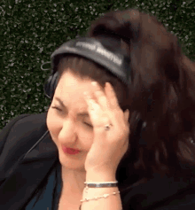 a woman wearing headphones with the word smith on them