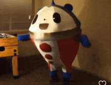 a stuffed animal in a red white and blue suit