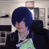 a woman with blue hair holds a bag of chips