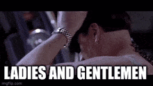 a man is covering his face with his hand and the words ladies and gentlemen are written on the screen .
