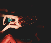 a woman in a red corset is laying on her back
