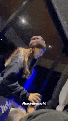 a man and a woman are dancing together in a room .