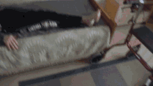 a person laying on a couch with a shirt that says i dont know