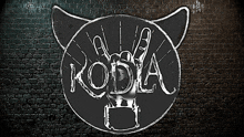 a brick wall with a sign that says koda