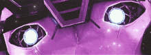 a close up of a robot 's eyes with purple and blue lights