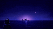 a group of people looking at a crescent moon