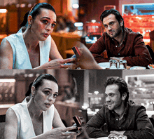 a man and a woman are sitting at a table and the woman is holding a box