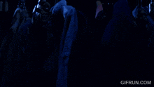 a gif from gifrun.com shows a skeleton in a dark room