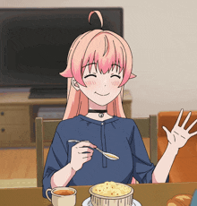 a girl sitting at a table with a cup of coffee and a bowl of food