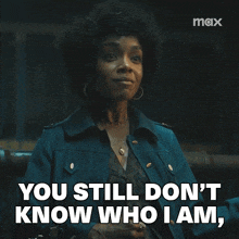 a woman in a blue jacket says you still don t know who i am