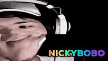 a man wearing headphones and a hat with the name nickybobo on the bottom