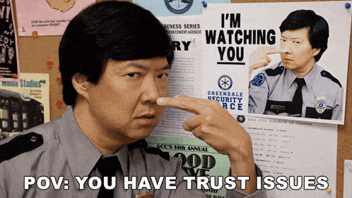 a man points at a poster that says 