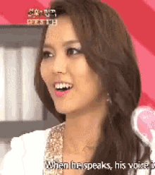 a close up of a woman 's face with the words when he speaks his voice behind her .
