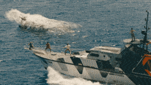 a boat that has the number 13 on the side