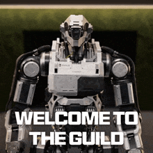 a robot with the words welcome to the guild on the bottom