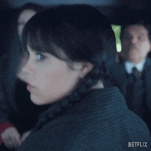 a close up of a woman 's face with netflix written on the bottom