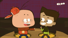 two cartoon characters are standing next to each other with the letters ok on the bottom right