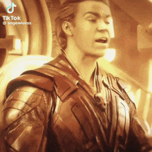 a man in armor with a skull on his chest is on a tik tok