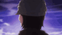 the back of a person wearing a hat against a purple sky