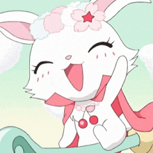 a white rabbit with a red star on its head is sitting on a sleigh .