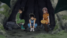 a group of anime characters are sitting on rocks