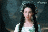 a woman wearing a white dress and a crown of flowers