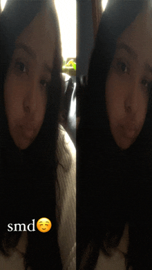 a woman 's face is shown with the word smd below it