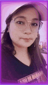 a woman wearing glasses and a hat is taking a picture