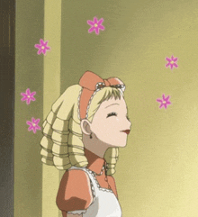 a cartoon girl is standing in front of a yellow wall with pink flowers flying around her head .