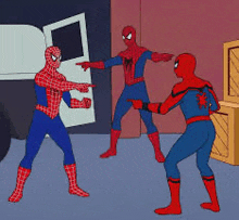 three spider-men are standing next to each other in a room .