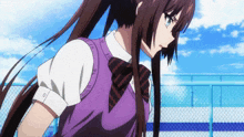 a girl with long hair wearing a purple vest