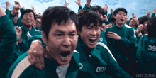 a group of people wearing green uniforms with the number 39 on the back