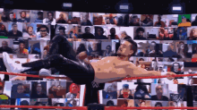 a man in a wrestling ring with a w logo on his shirt