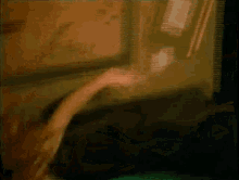 a woman is laying on a couch with her head down .
