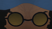 a close up of a man 's face with a pair of glasses on
