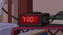 a digital alarm clock displays the time as 7:30 am