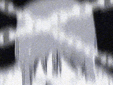 a black and white image of a waterfall with a lot of lines coming out of it .