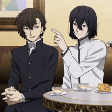 two anime characters are sitting at a table with cups of tea and pancakes