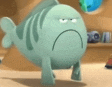 a cartoon fish with a sad face is walking on the floor .