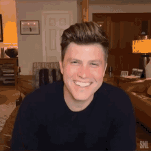 Laughing Colin Jost GIF