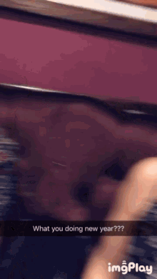a blurred image of a person asking what they are doing