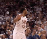 a basketball player wearing a white jersey with the number 45