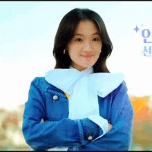 a woman wearing a blue jacket and a white tie