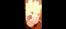 a close up of naruto 's face with a yellow headband on