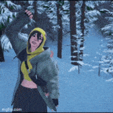 a girl in a hoodie is standing in the snow