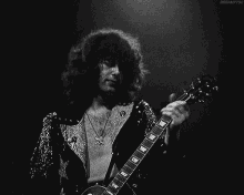 Jimmy Page GIF - Jimmy Page Guitar Play GIFs