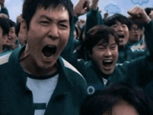 a group of people wearing green and white uniforms with the letter o on them