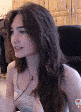 a woman wearing a tank top that says ' i 'm all ' on it